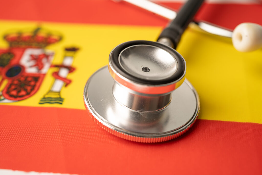 Black stethoscope on Spain flag background, Business and finance concept.