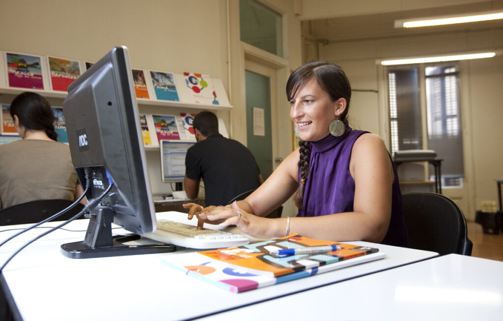 Photo of language student on computer.