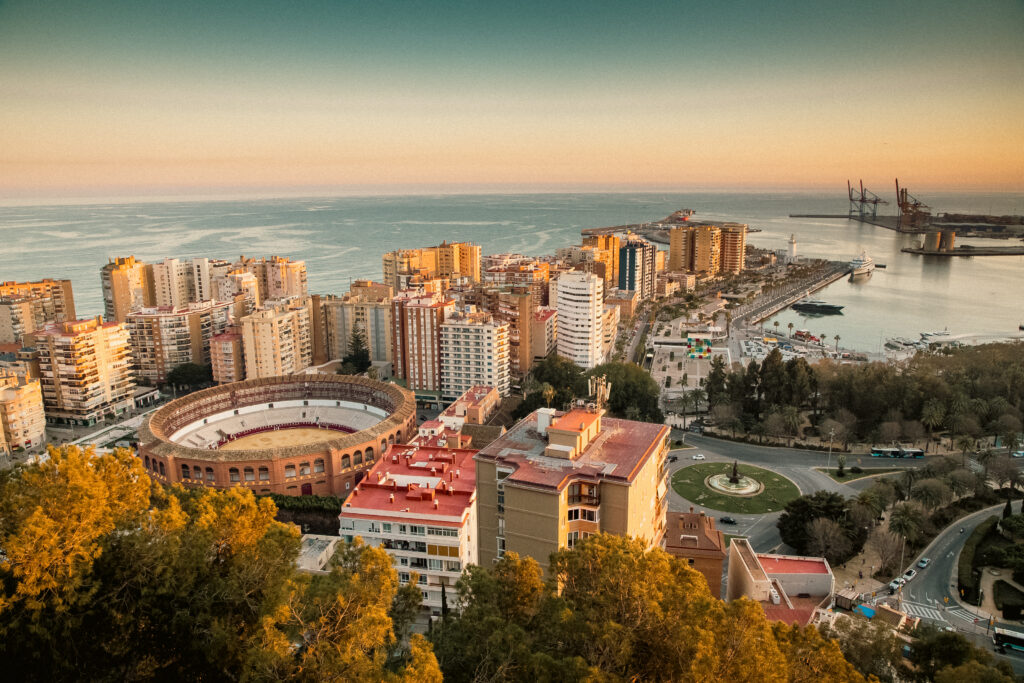 Photo of view over Malaga at sunset travel banner.