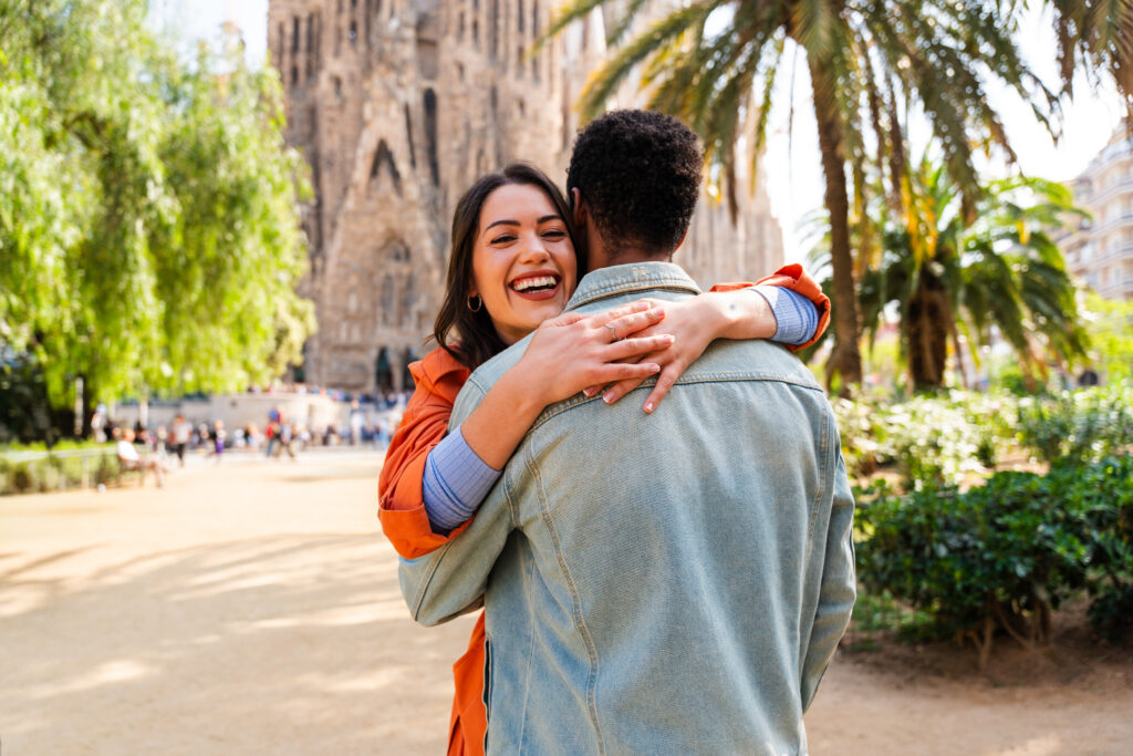 Photo of a happy couple at Sagrada Familia, Barcelona in Spain.
