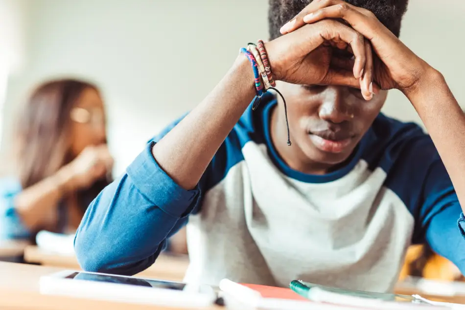 Stressed young student sitting