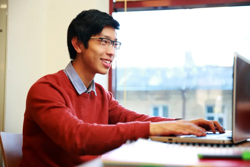 Man on computer studying. Man on computer studying.